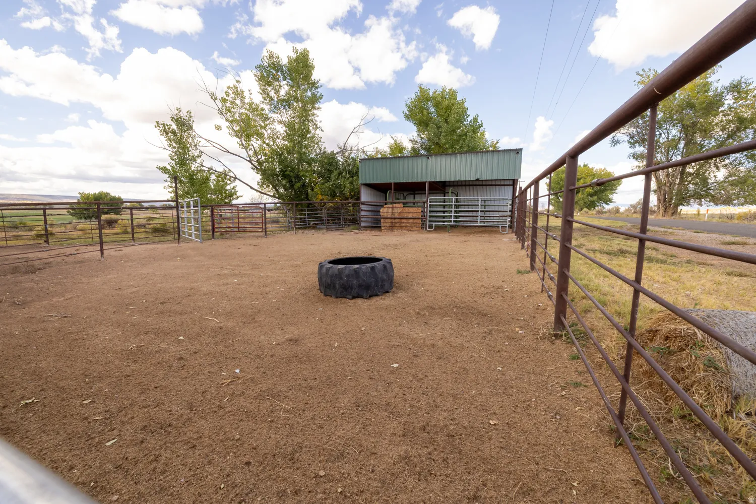 View of yard with an exterior structure, an outbuilding, and a rural view