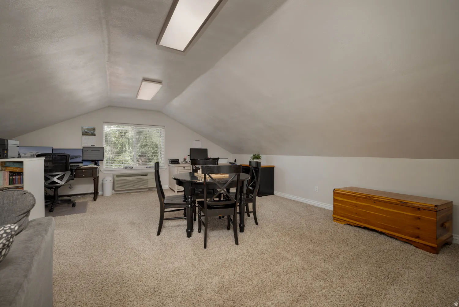 Home office featuring light carpet