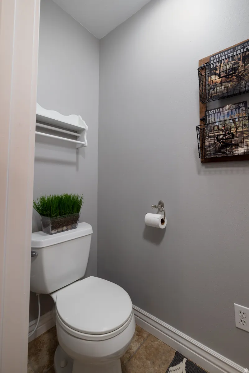 Bathroom featuring baseboards and tile patterned floors