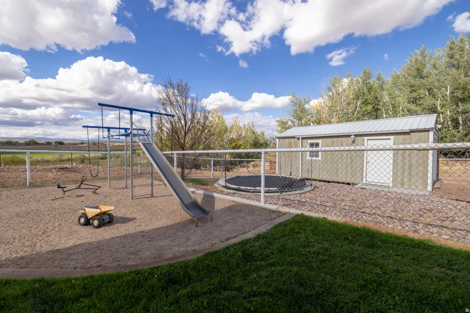 Community jungle gym featuring a trampoline