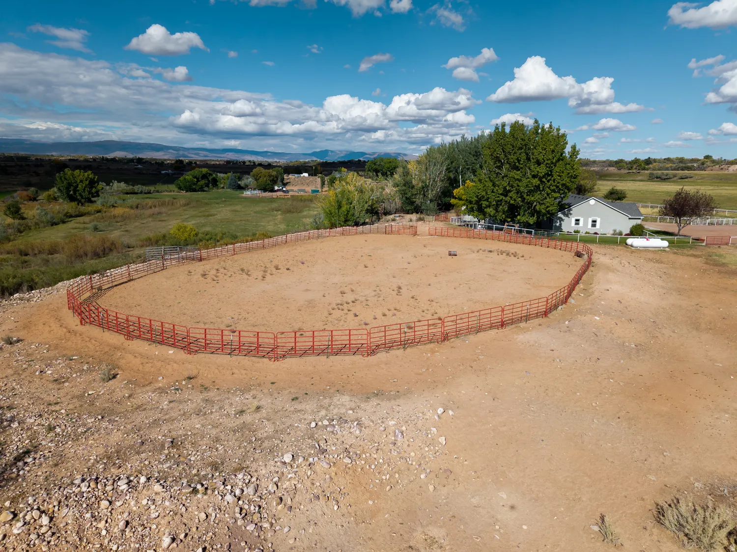 View of yard featuring an enclosed horse arena and a view of rural / pastoral area