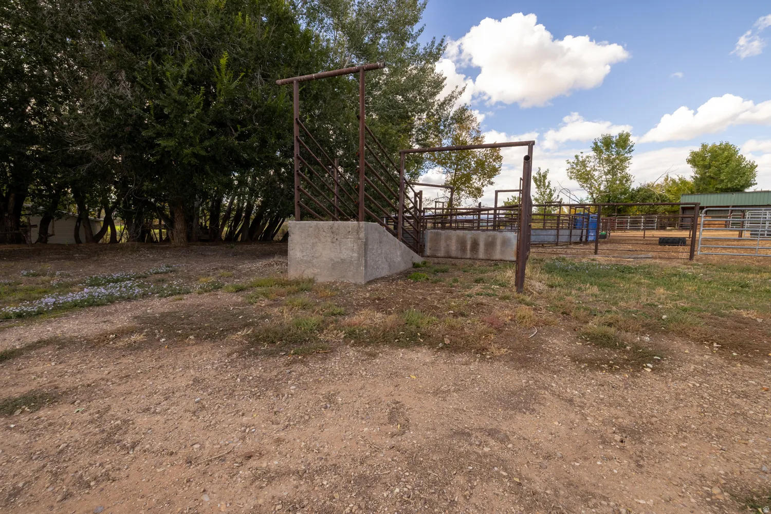 View of yard featuring an outbuilding and an exterior structure