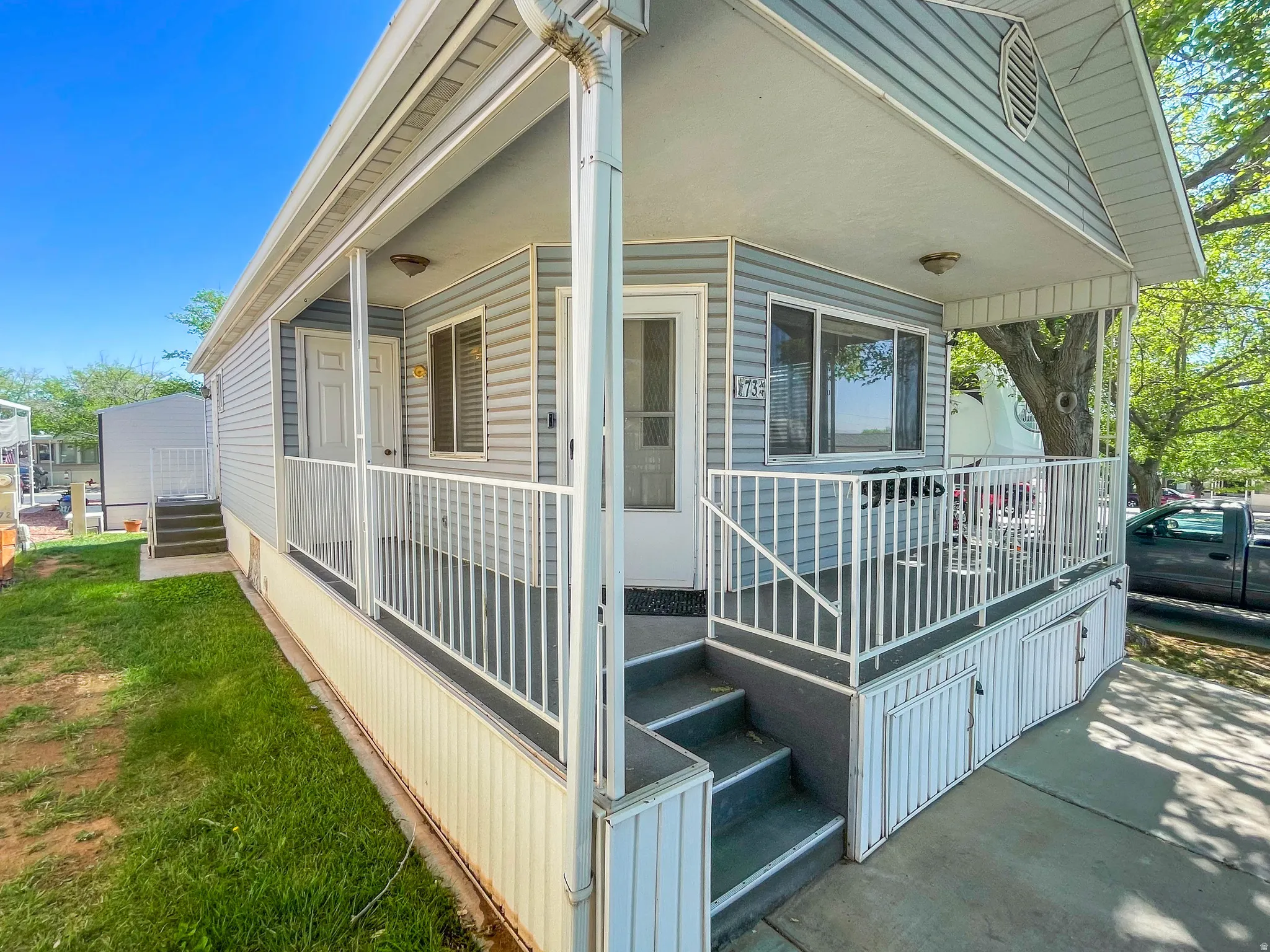 View of side of home with a porch
