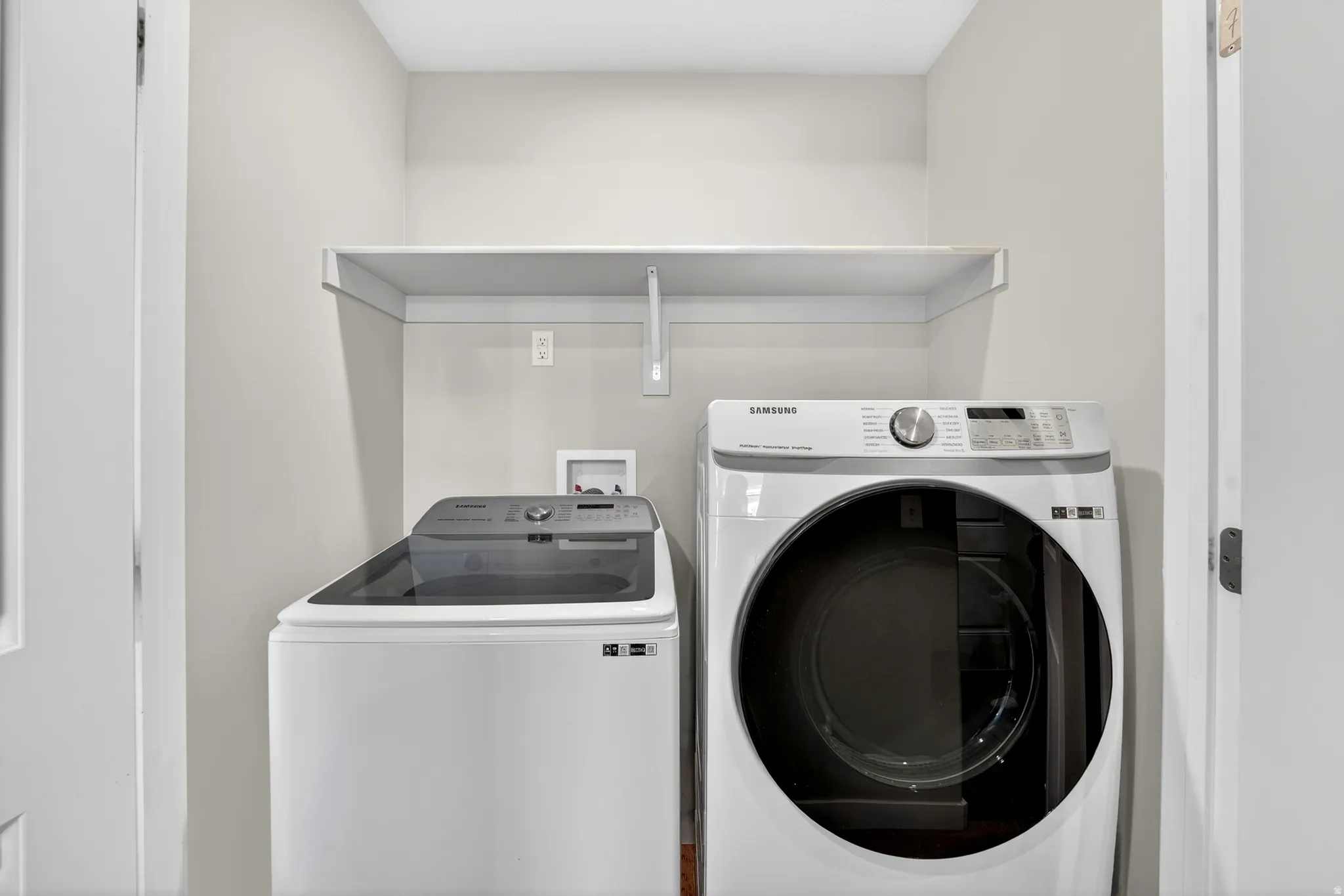 Laundry area with separate washer and dryer