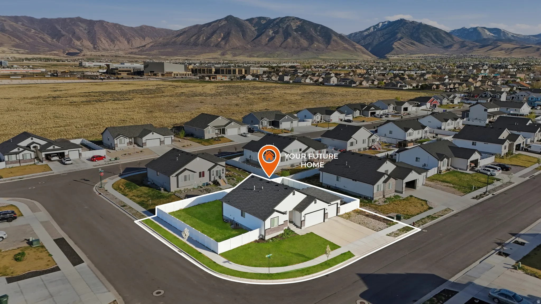 Aerial view of residential area with a mountain backdrop