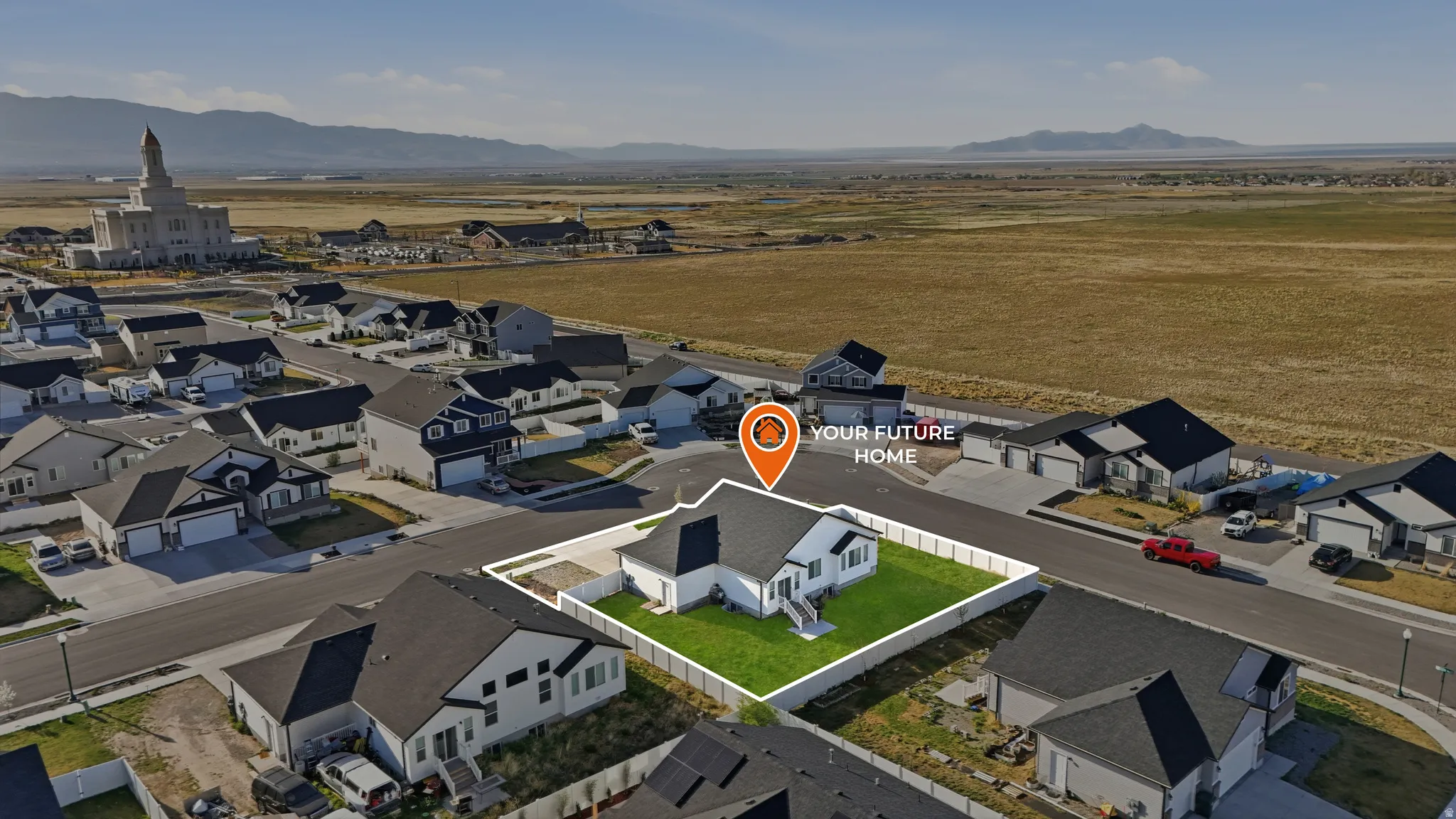 Aerial view of residential area featuring mountains