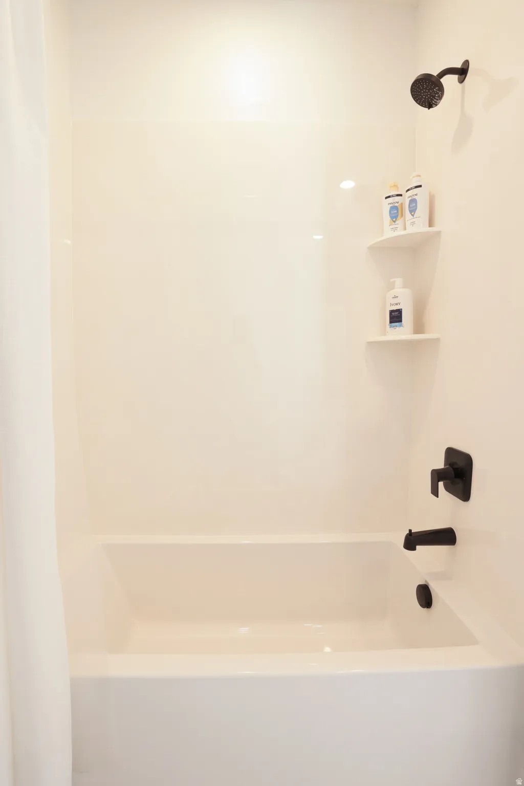 Full bathroom featuring shower / bath combo