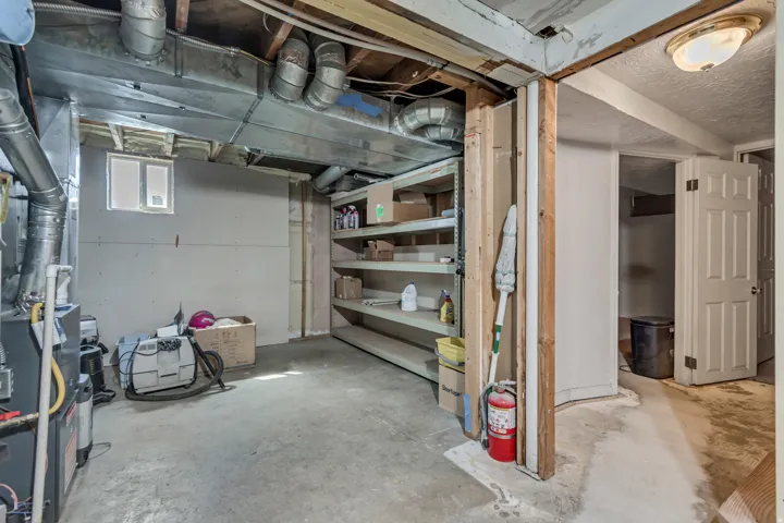 Below grade area featuring heating unit