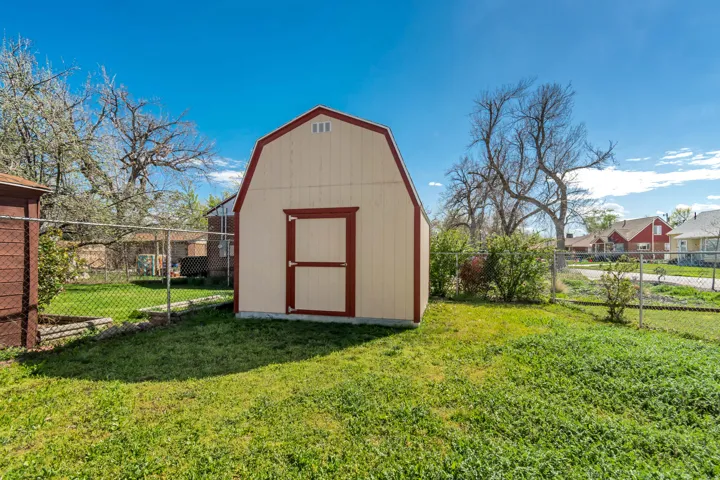 View of shed featuring a fenced backyard