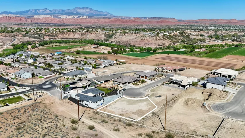 Aerial perspective of suburban area with a mountain backdrop