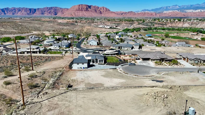 Aerial view of residential area with a mountainous background