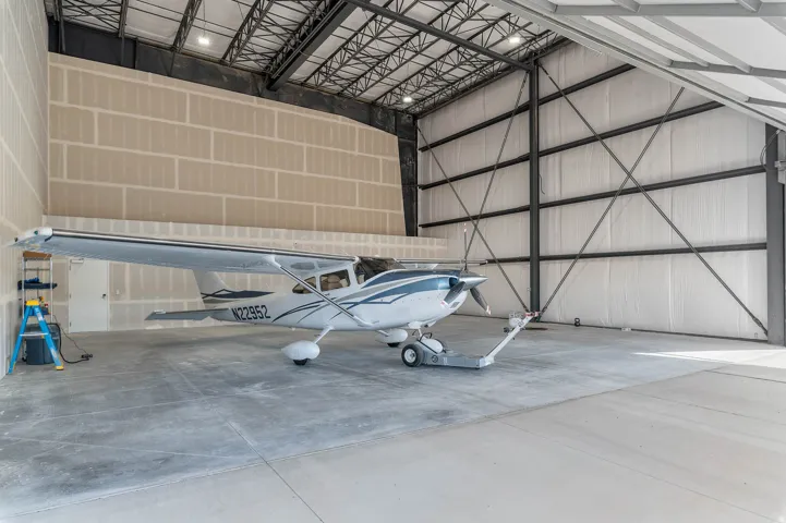 Garage featuring metal wall