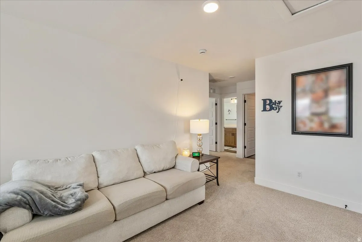Living area with carpet floors and baseboards