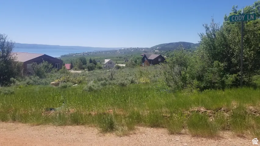 View of mountain backdrop with rural landscape