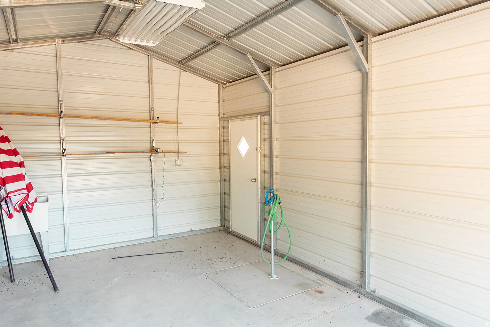 Garage featuring metal wall