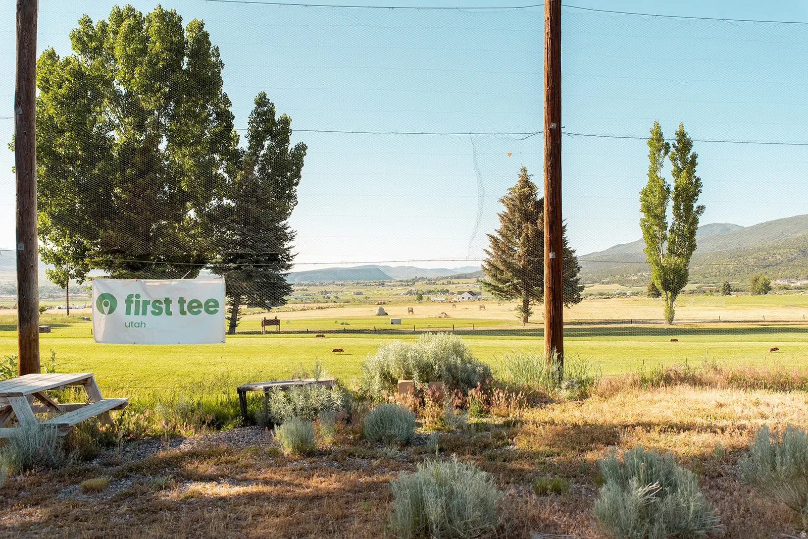 View of green lawn featuring a mountain view