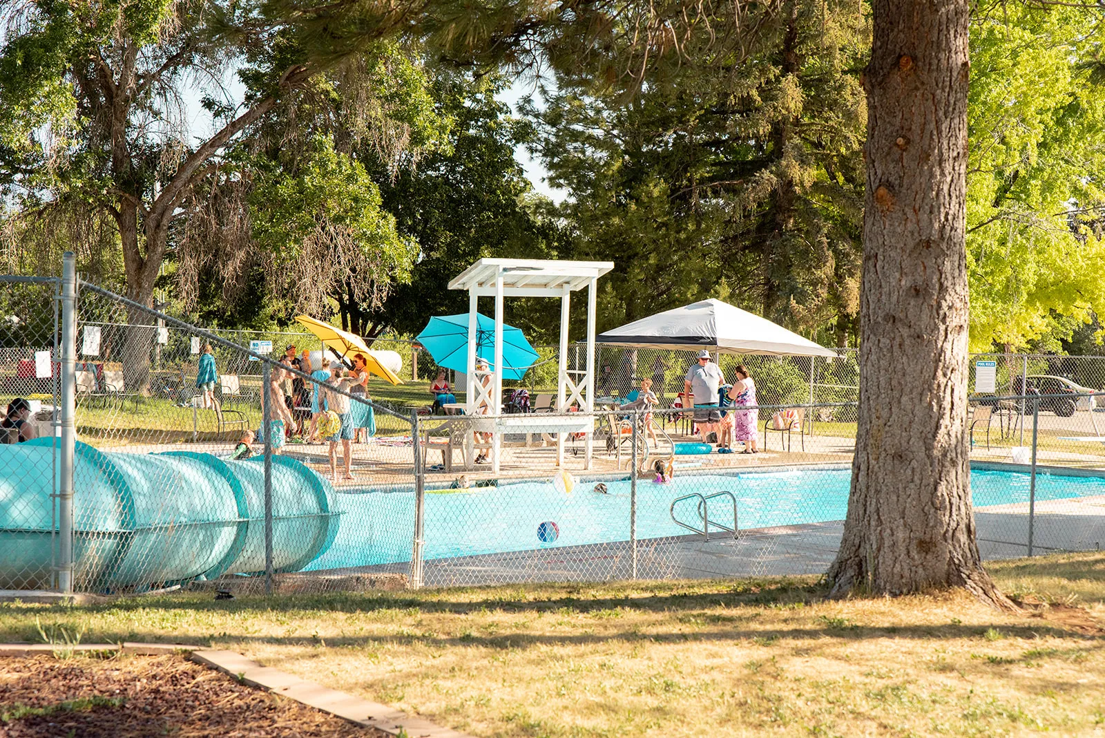 Community pool featuring a water play area