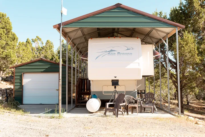View of outbuilding featuring a carport