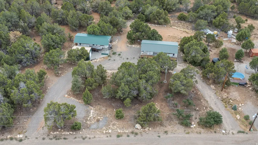 Two detached structures with metal roofing