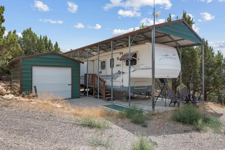 Steel-framed carport structure