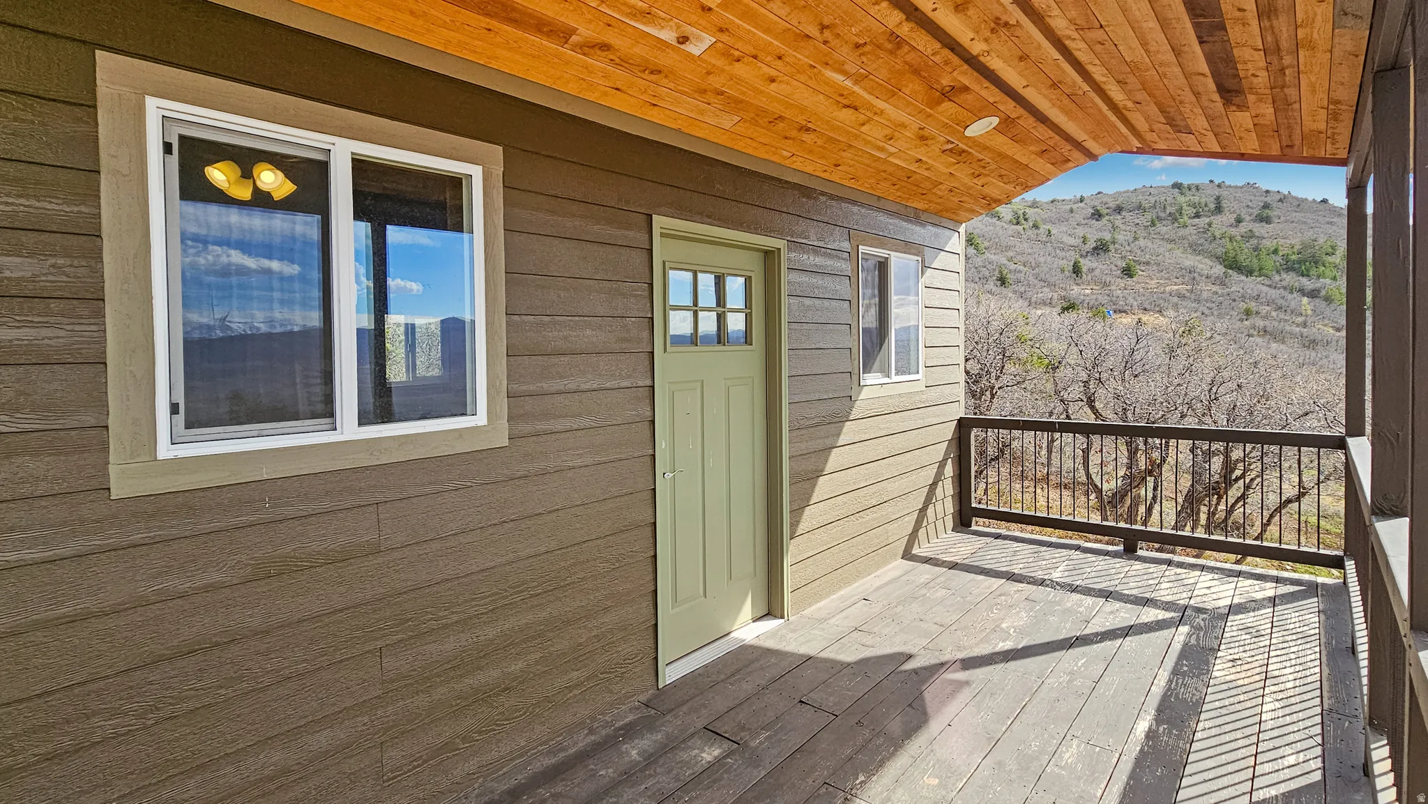 Guest Cabin Balcony with a deck with mountain view