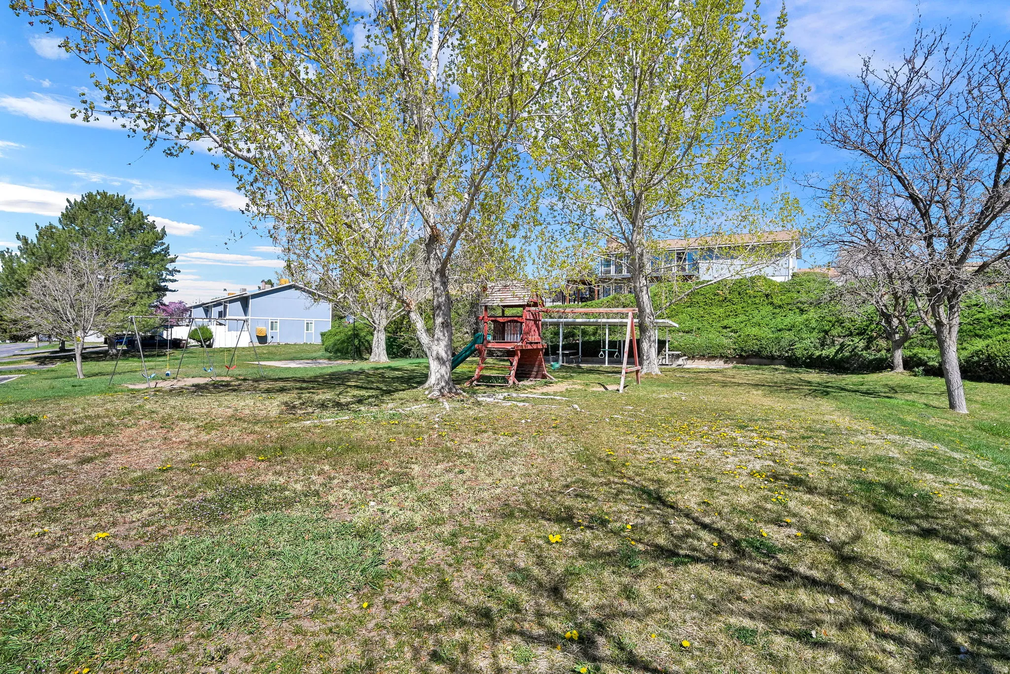 View of green lawn featuring a playground