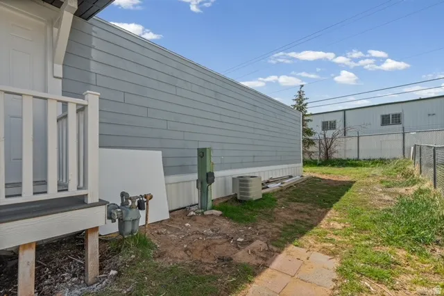 View of property exterior with a central air condition unit