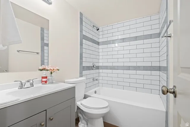 Bathroom with vanity and tub / shower combination
