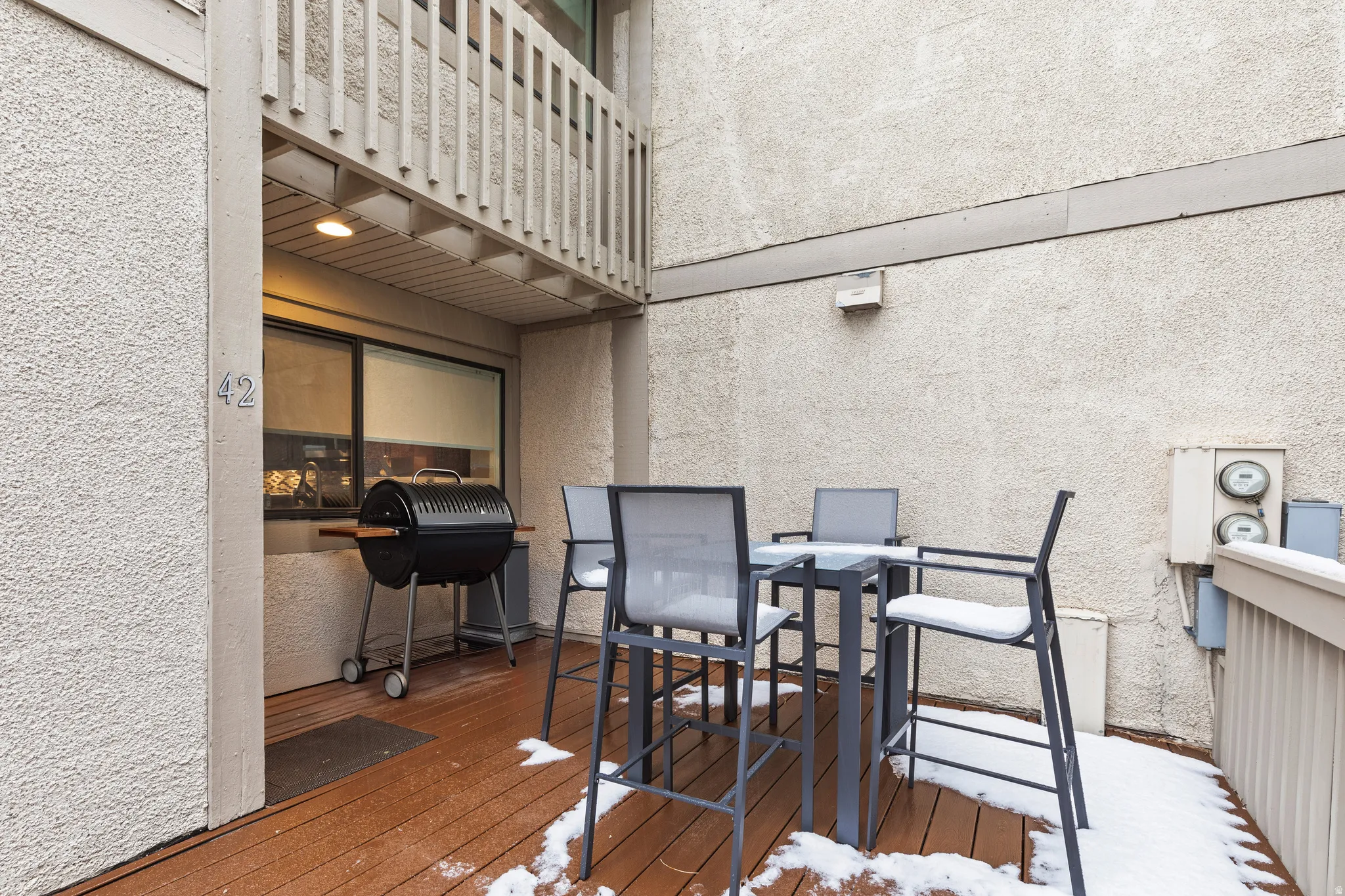 Wooden terrace featuring area for grilling