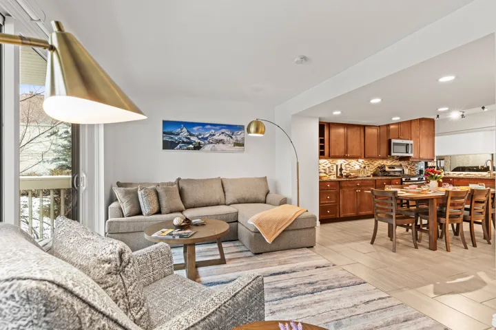Living area featuring wood finish floors and recessed lighting