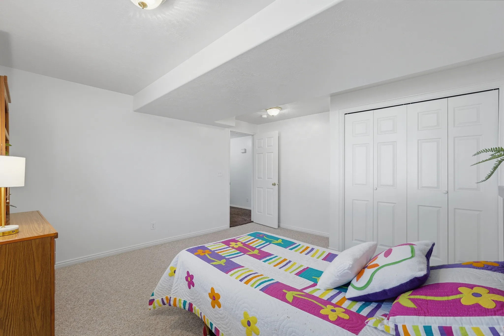 Carpeted bedroom with baseboards