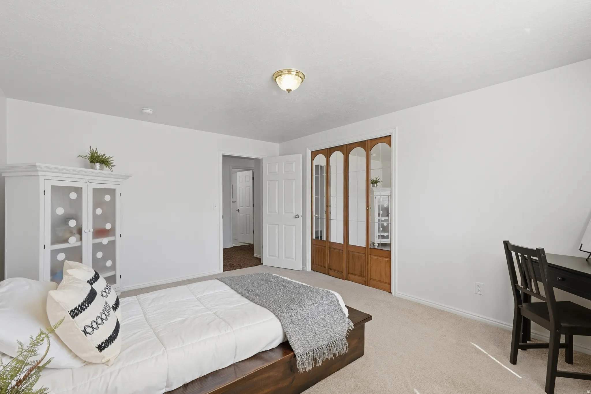 Carpeted bedroom with baseboards