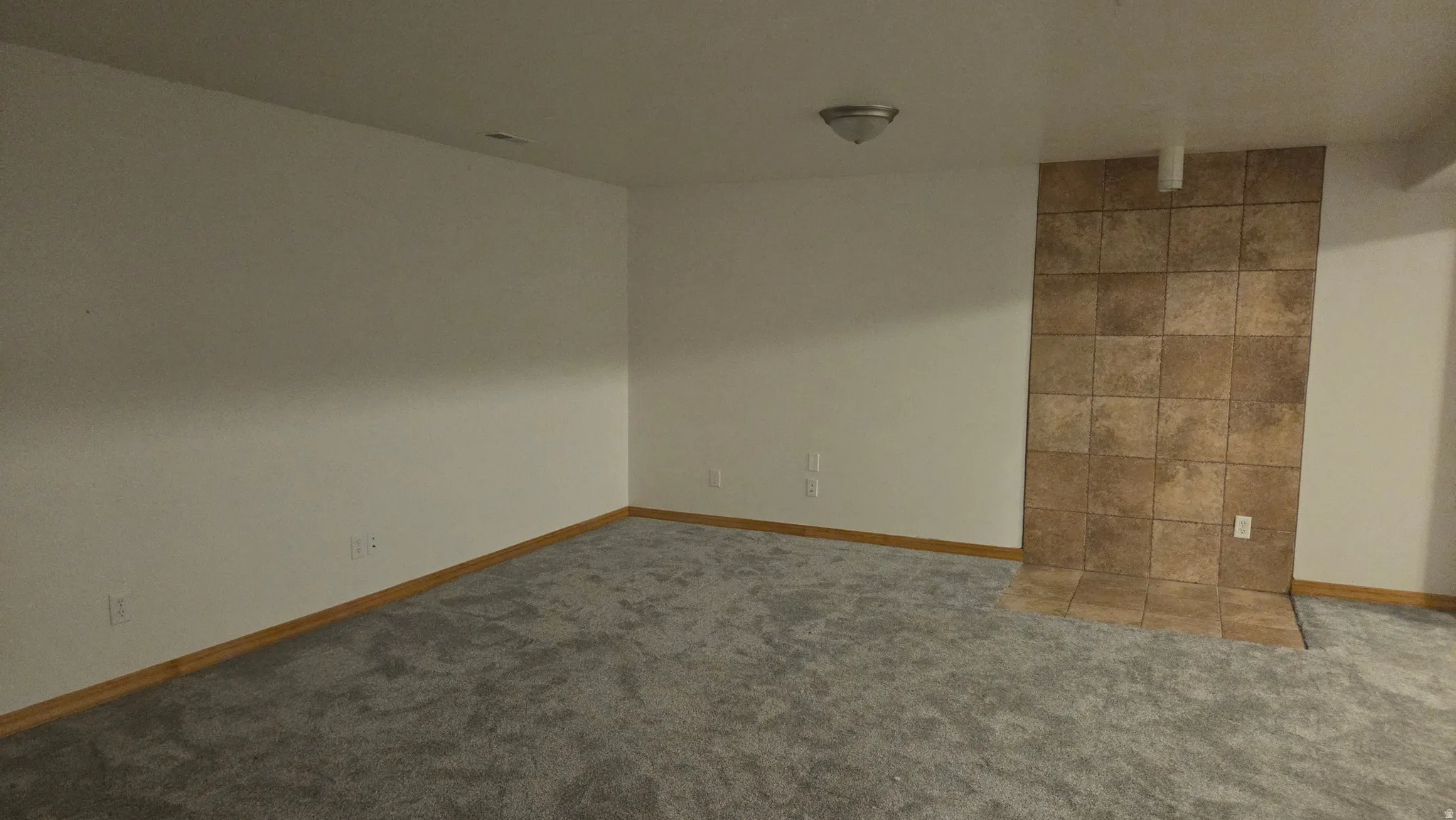 Family room with place ready for a pellet stove