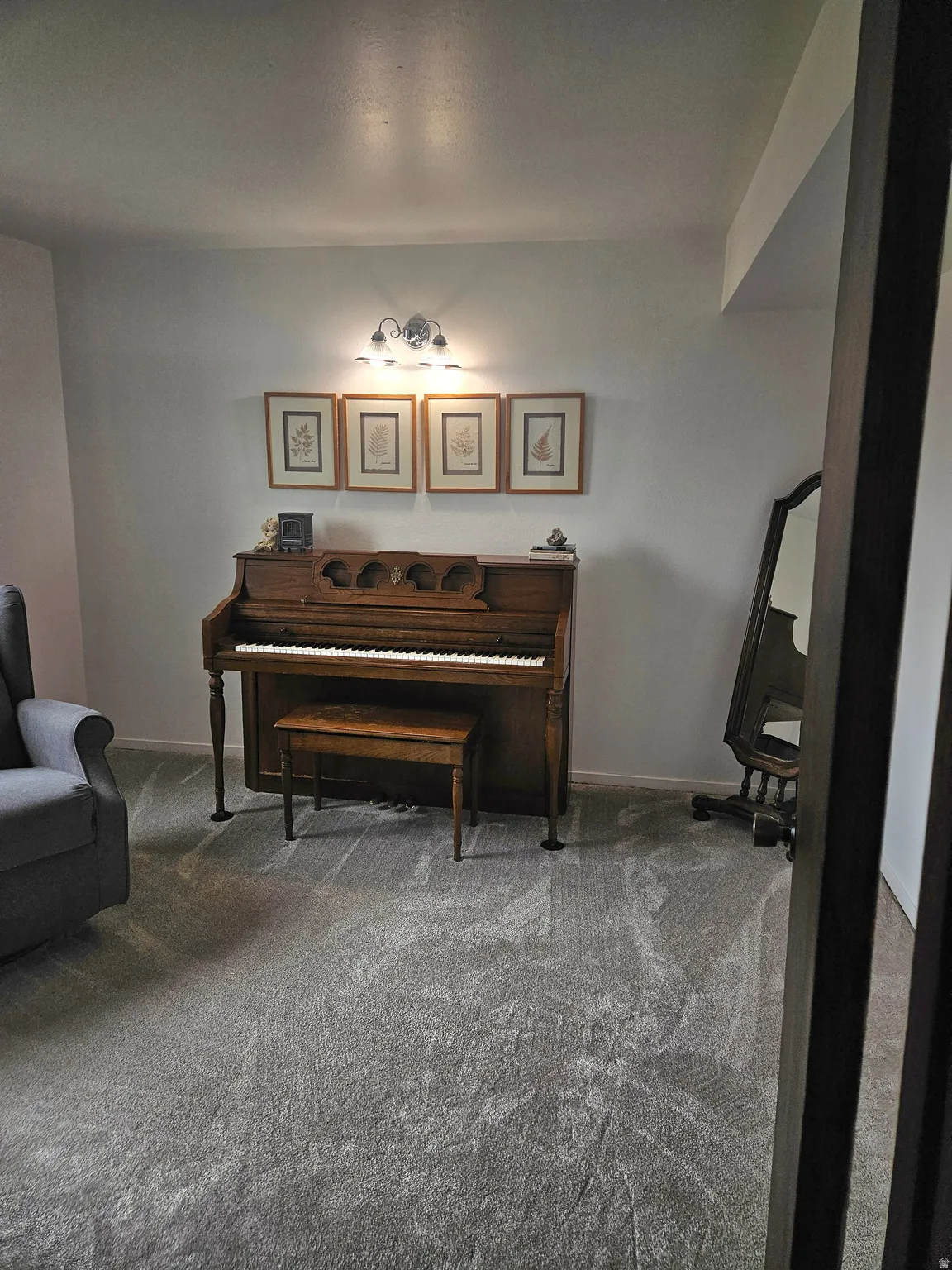 Sitting room featuring carpet floors