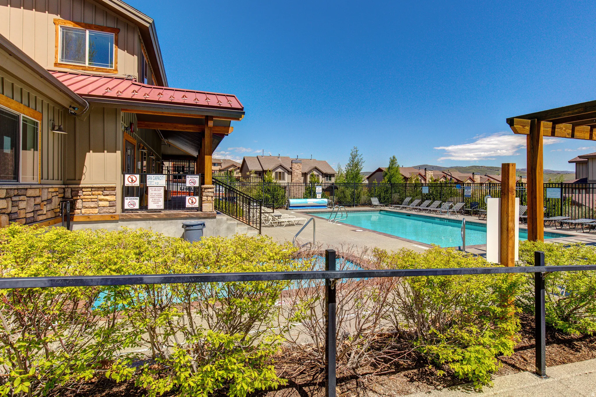 Community pool featuring a residential view and a patio