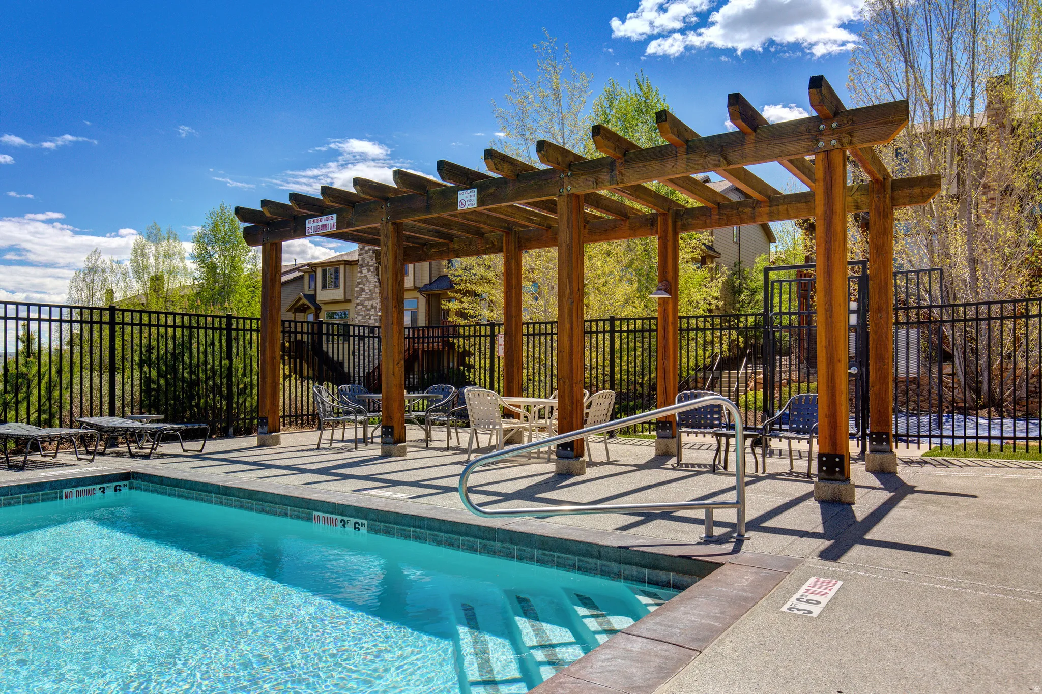 Community pool with a pergola and a patio