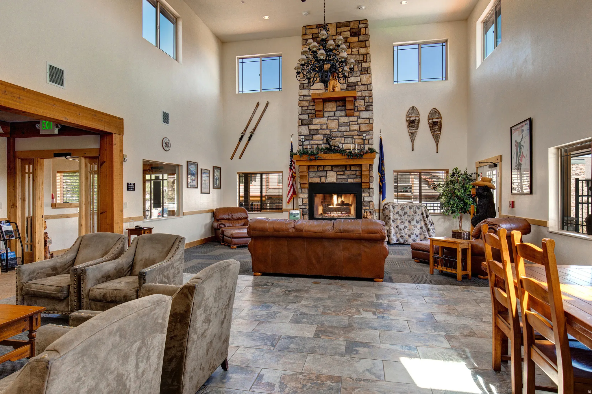 Living room with a fireplace and a high ceiling