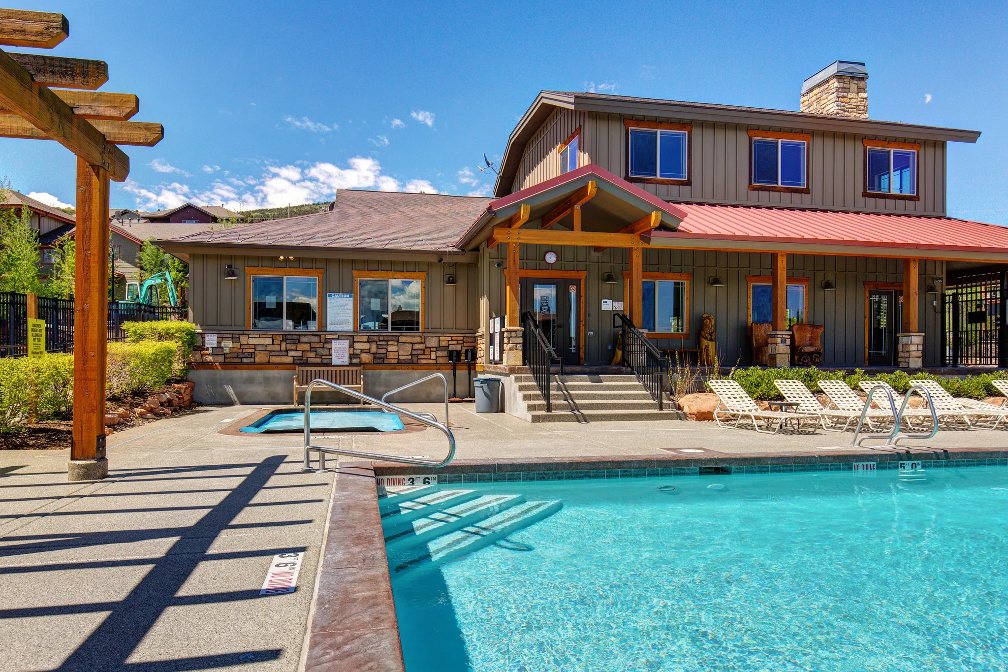 Community pool with a patio area