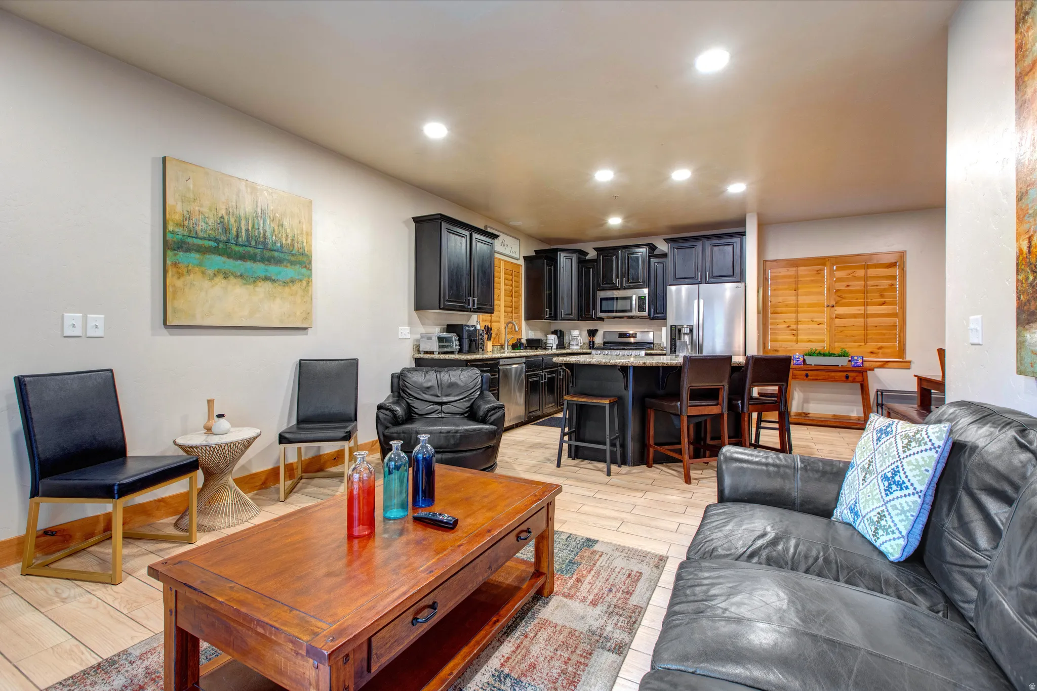Living room with wood tiled floors and recessed lighting