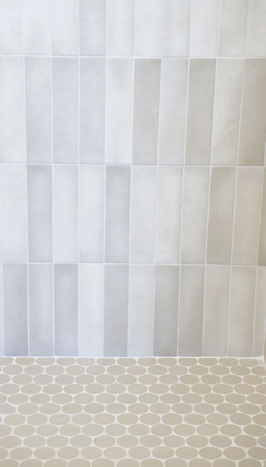 Full bath featuring a tile shower