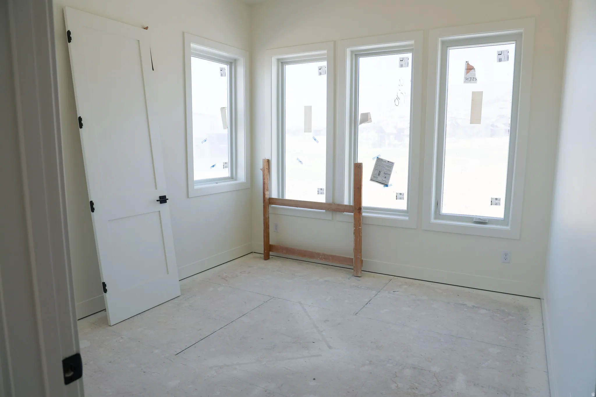 Unfurnished room with baseboards