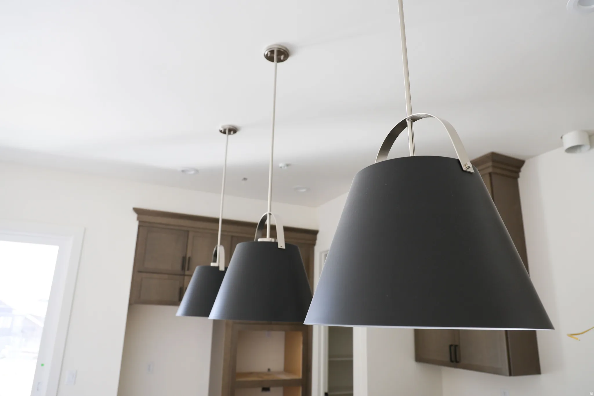 Kitchen view of hanging light fixtures