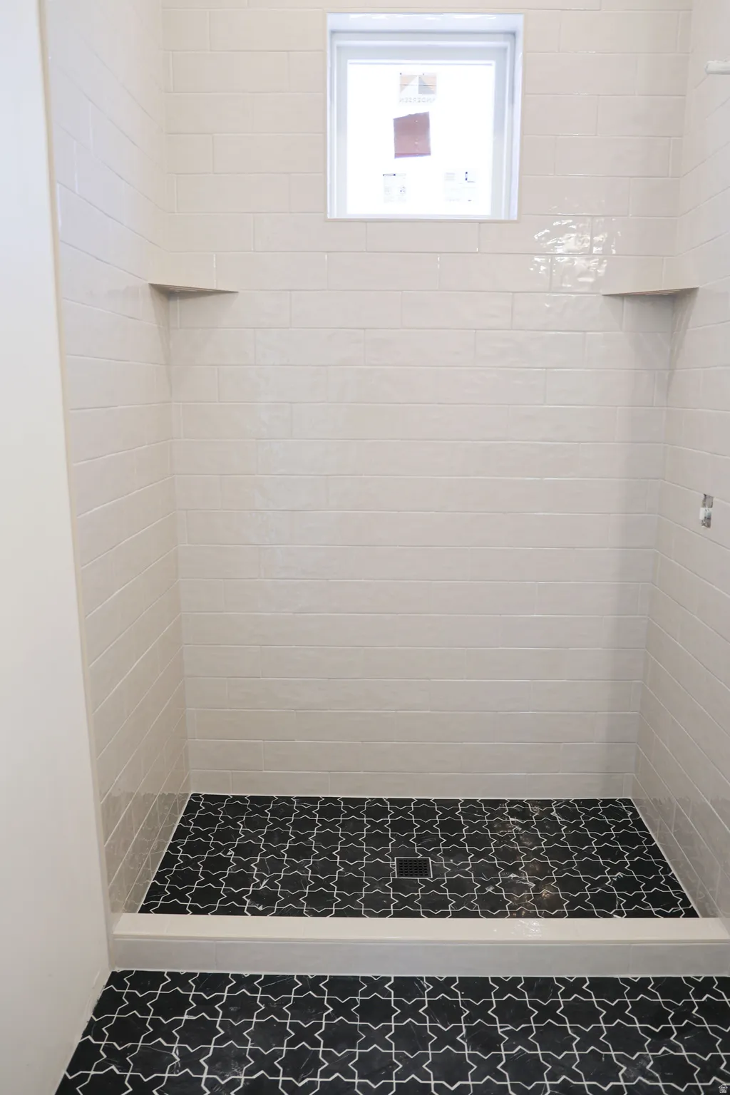 Full bath featuring a stall shower