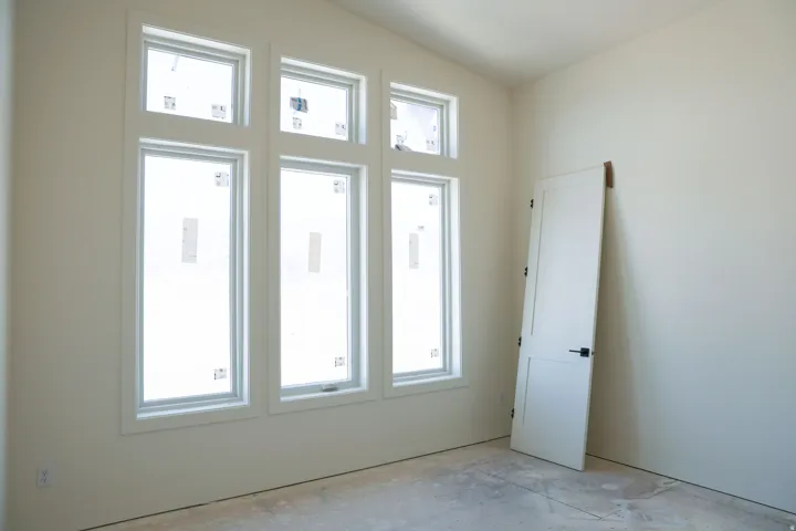 Unfurnished room featuring lofted ceiling