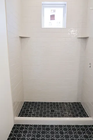 Full bath featuring a stall shower