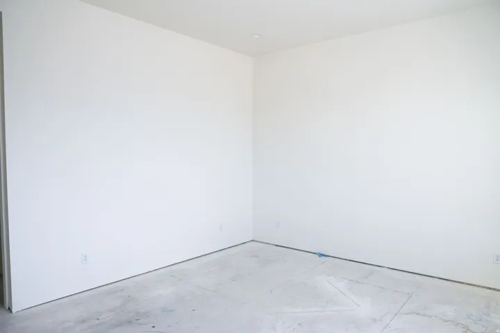 Unfurnished room featuring concrete flooring