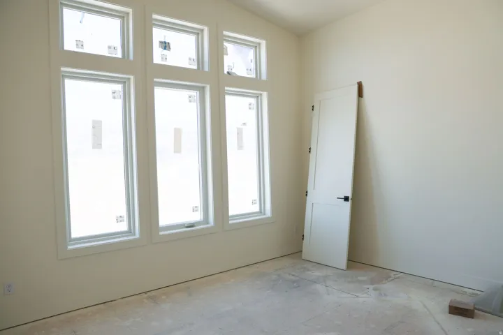Empty room with vaulted ceiling