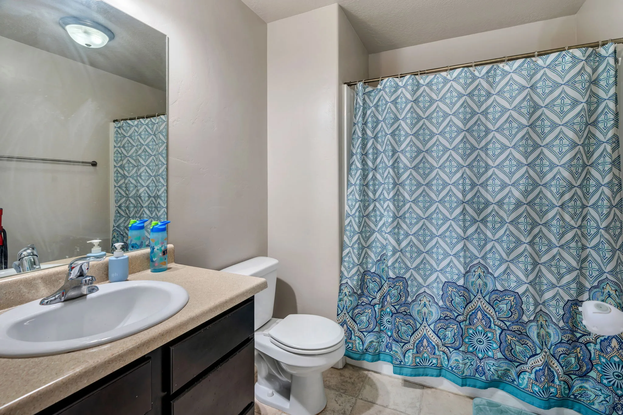 Bathroom featuring vanity and a shower with curtain