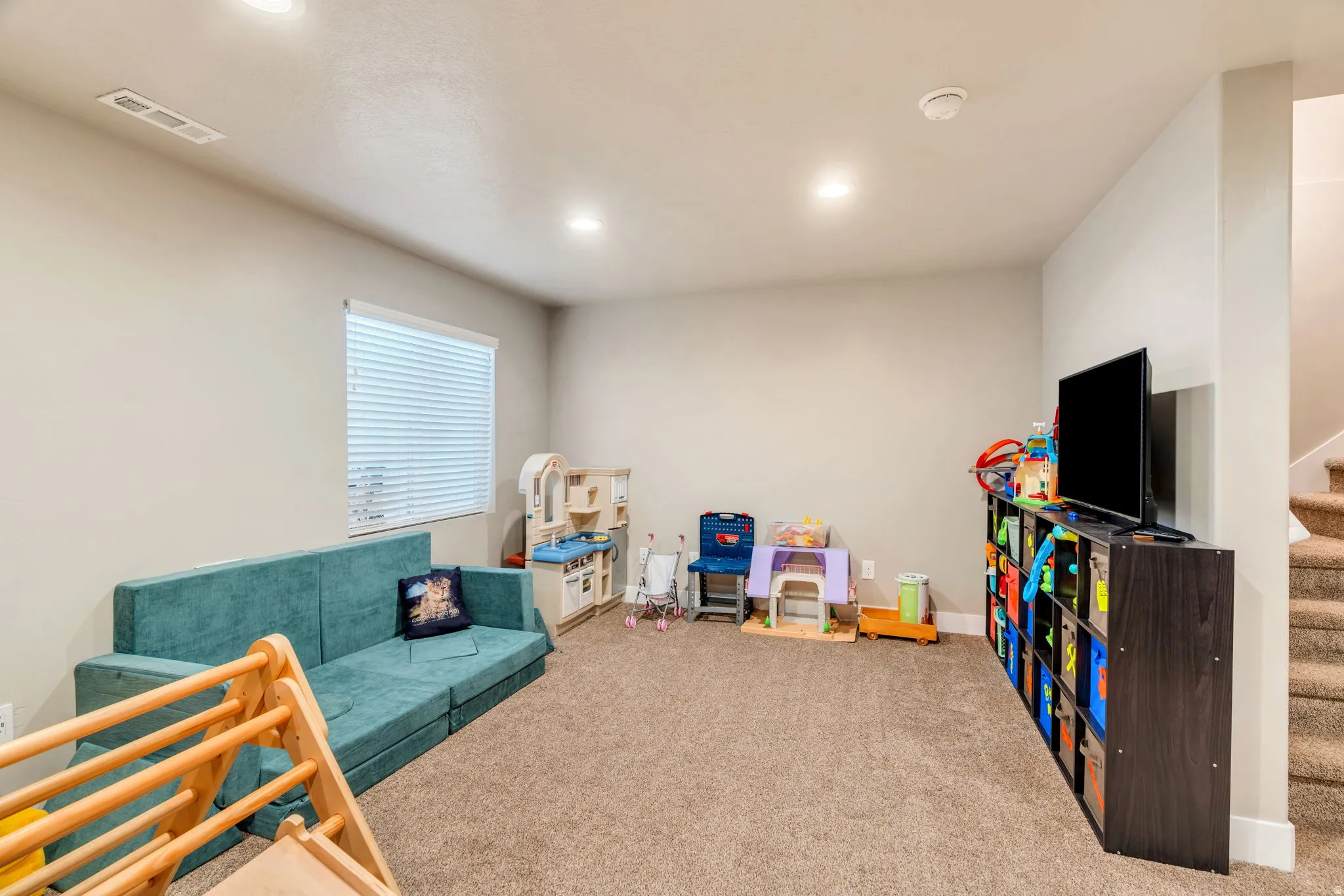 Recreation room featuring carpet floors and recessed lighting