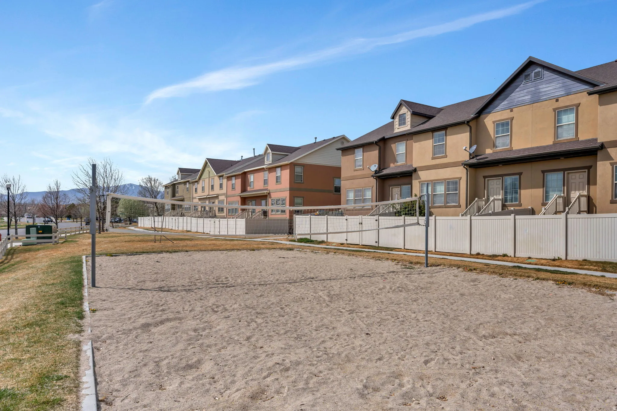 View of home's community featuring volleyball court and a residential view